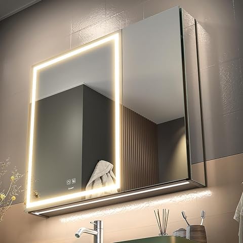 Armoire de toilette Ganpe à deux portes avec éclairage LED et étagères en verre dans une salle de bain claire
